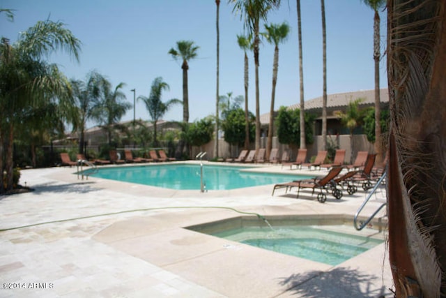 view of swimming pool with a patio