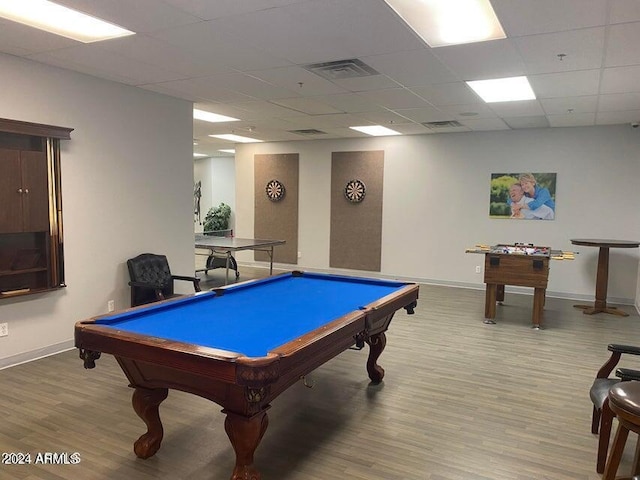 game room featuring a paneled ceiling, hardwood / wood-style floors, and billiards