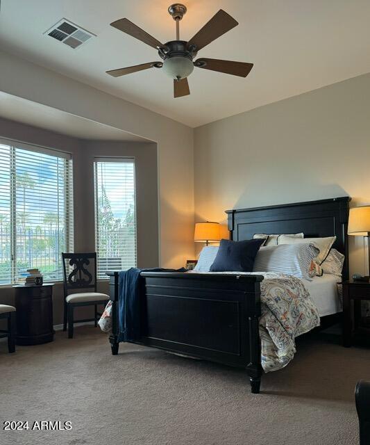 carpeted bedroom with ceiling fan