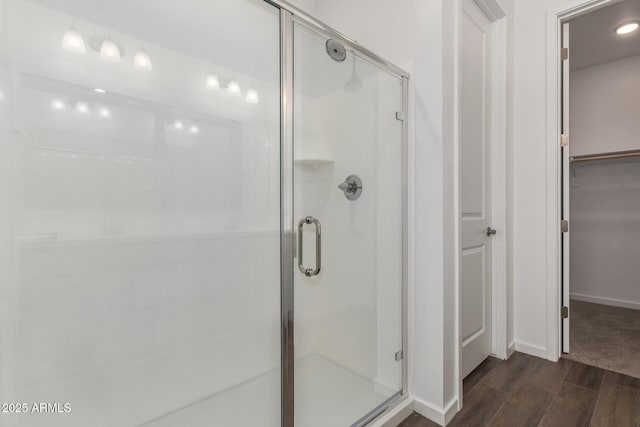 12362 W Marguerite Ave, Avondale, AZ 85323 - full bath featuring a stall shower, wood finished floors, and a walk in closet