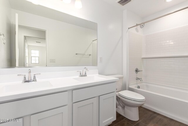 12362 W Marguerite Ave, Avondale, AZ 85323 - full bathroom featuring double vanity, shower / tub combination, and wood finished floors