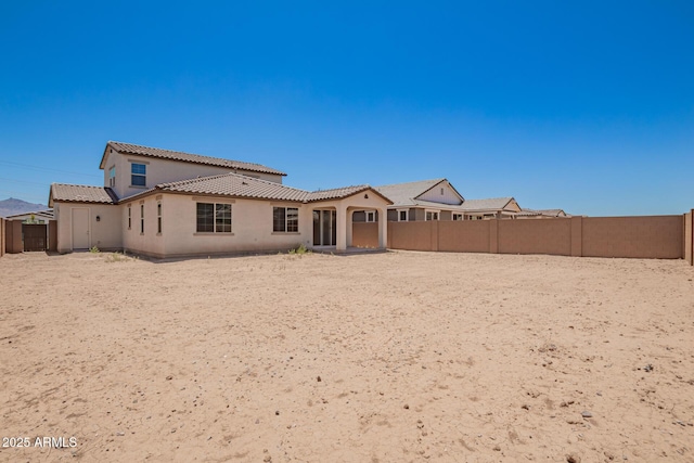 12362 W Marguerite Ave, Avondale, AZ 85323 - back of property with a tiled roof, a fenced backyard, and stucco siding