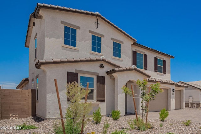 12362 W Marguerite Ave, Avondale, AZ 85323 - mediterranean / spanish home with a tiled roof, an attached garage, stucco siding, and driveway
