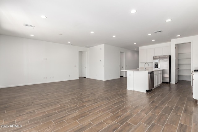 12362 W Marguerite Ave, Avondale, AZ 85323 - kitchen featuring open floor plan, stainless steel appliances, dark wood-type flooring, light countertops, and recessed lighting