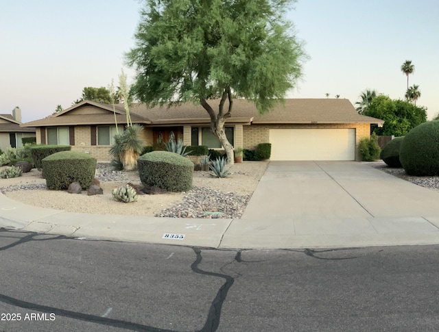 8355 E Via De Encanto, Scottsdale, AZ 85258 - single story home featuring a garage, driveway, and brick siding
