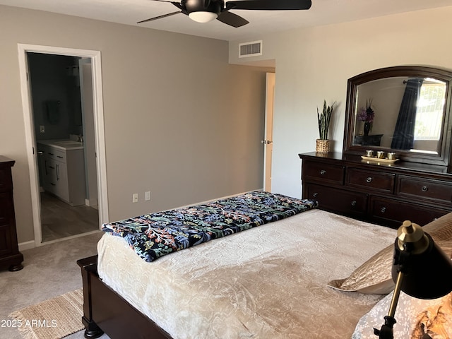 8355 E Via De Encanto, Scottsdale, AZ 85258 - bedroom with light colored carpet, ceiling fan, and ensuite bath
