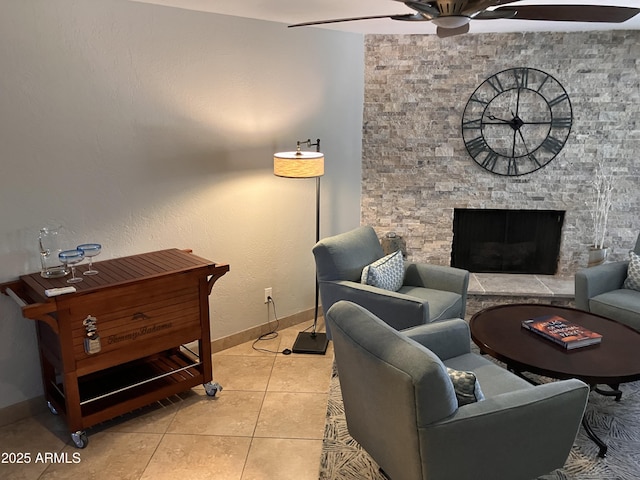 8355 E Via De Encanto, Scottsdale, AZ 85258 - tiled living area with a ceiling fan and a fireplace
