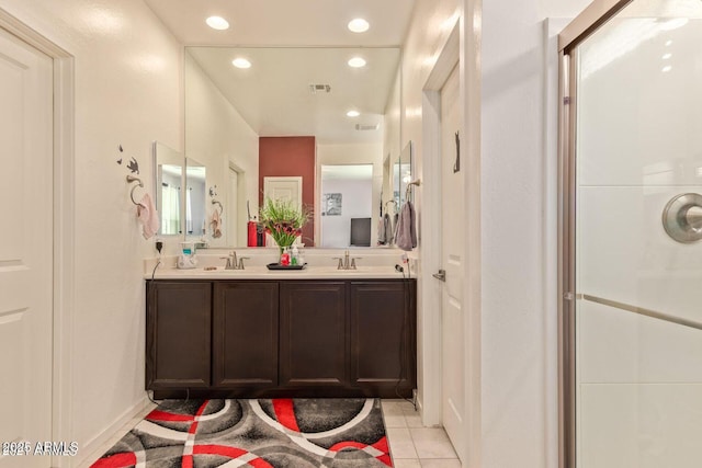 bathroom featuring tile patterned flooring, a sink, visible vents, and recessed lighting