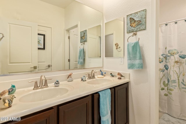 full bathroom with a sink and double vanity