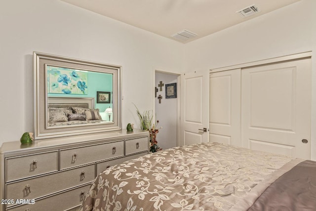 bedroom featuring a closet and visible vents