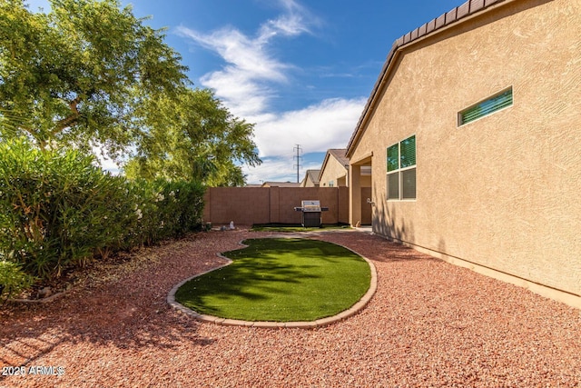 view of yard with a fenced backyard and a patio