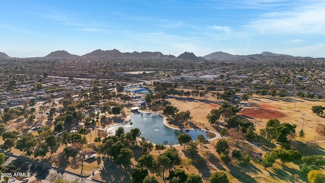 bird's eye view with a water and mountain view