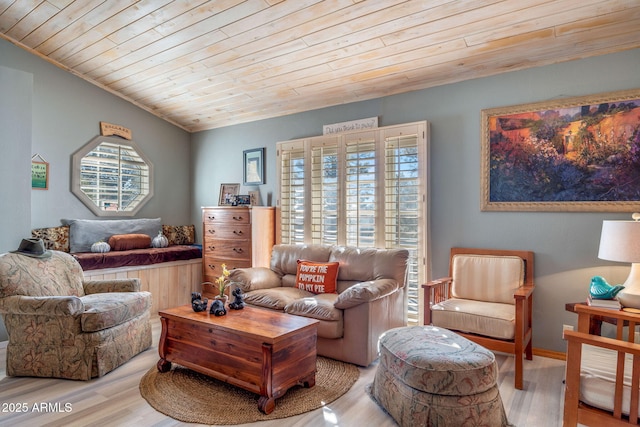 living room featuring light hardwood / wood-style floors, wooden ceiling, and vaulted ceiling