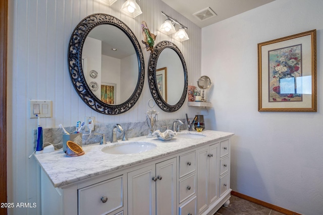 bathroom with vanity and tile patterned flooring