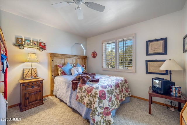 bedroom featuring ceiling fan and light carpet