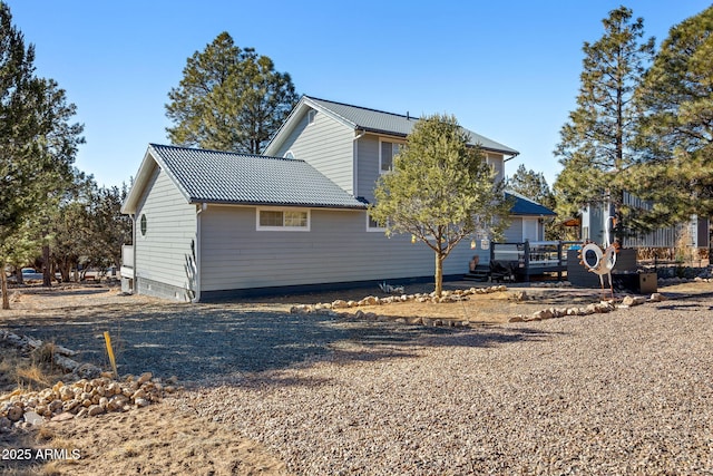 view of property exterior featuring a deck