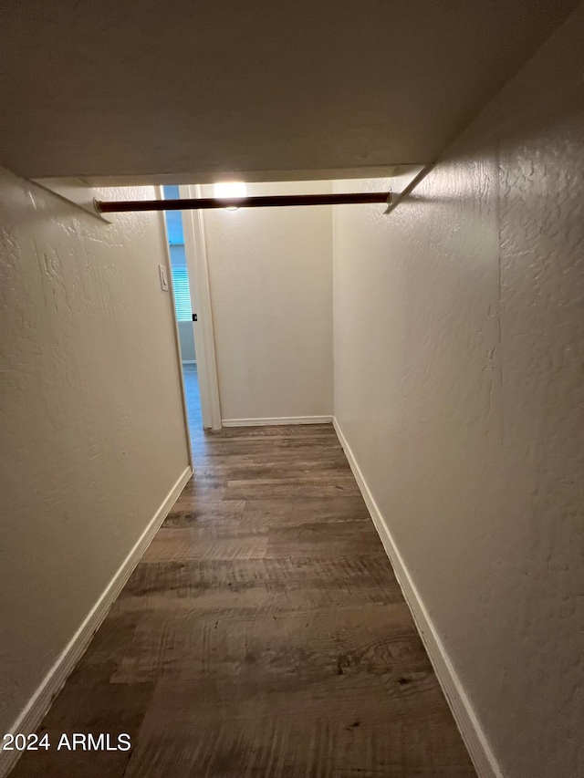 corridor featuring dark hardwood / wood-style flooring