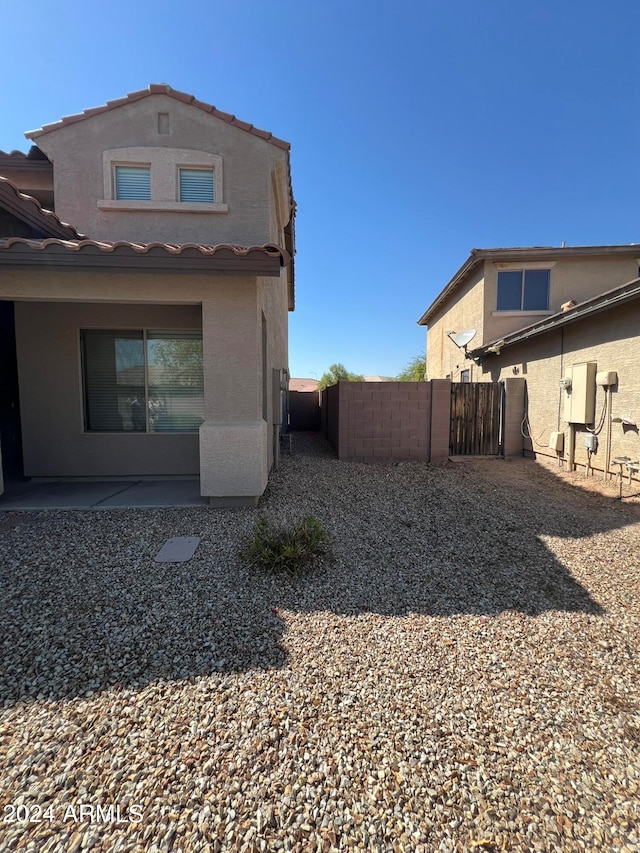 rear view of house featuring a patio