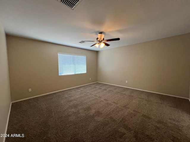 empty room featuring ceiling fan and carpet flooring