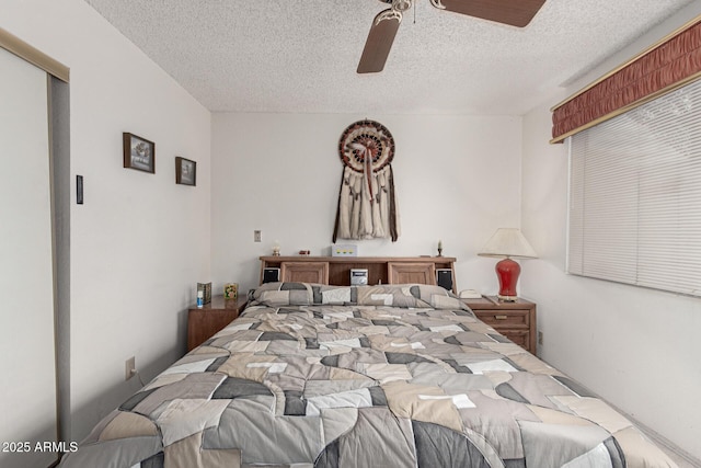 bedroom featuring a textured ceiling and ceiling fan