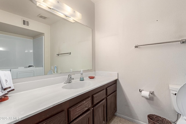 bathroom with visible vents, baseboards, toilet, and vanity