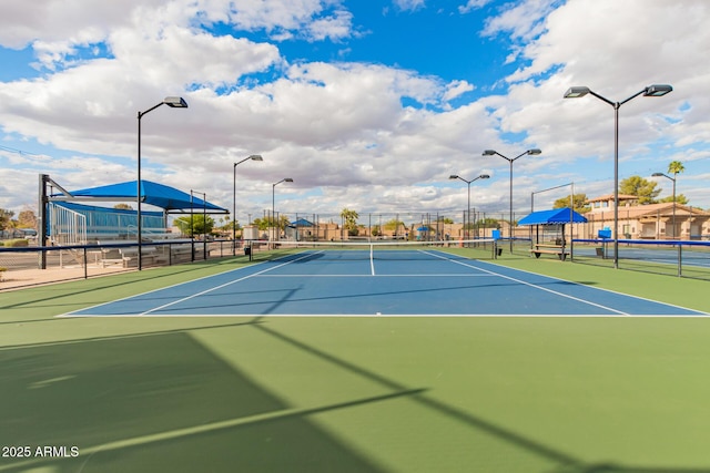 view of sport court with fence