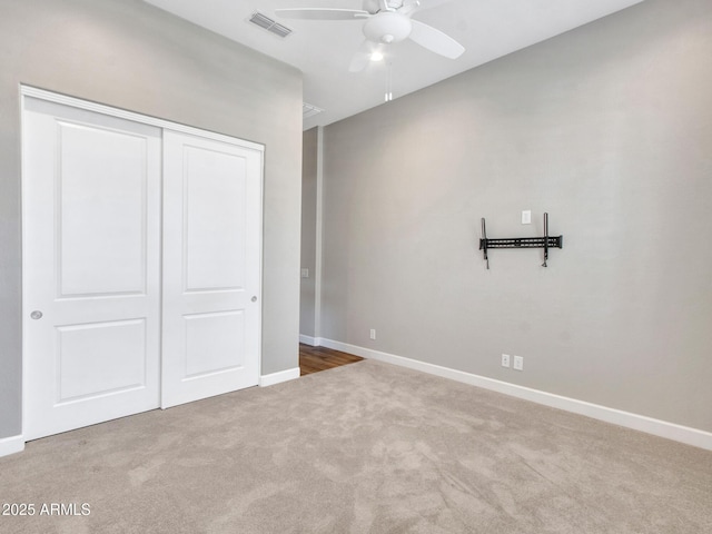 16881 W Merrell St, Goodyear, AZ 85395 - unfurnished bedroom with carpet floors, a closet, baseboards, and a ceiling fan