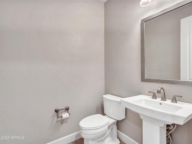 16881 W Merrell St, Goodyear, AZ 85395 - bathroom featuring toilet and baseboards