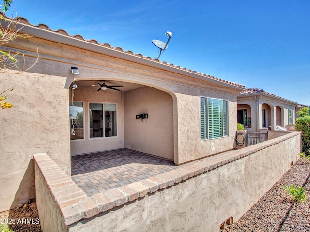 16881 W Merrell St, Goodyear, AZ 85395 - entrance to property with a ceiling fan, a patio, and stucco siding