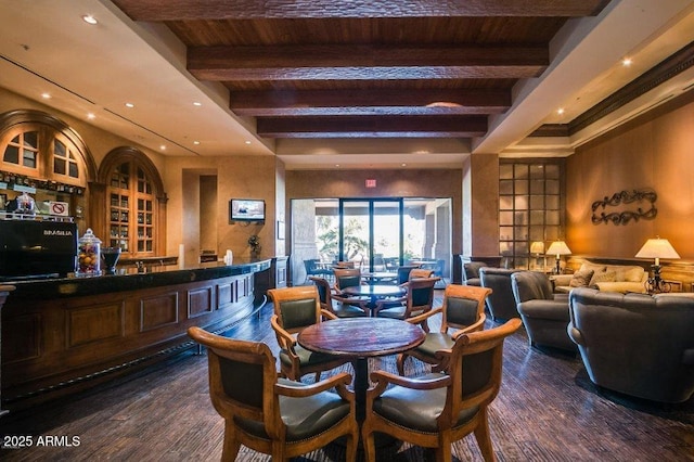 16881 W Merrell St, Goodyear, AZ 85395 - dining room featuring dark wood finished floors, recessed lighting, wood ceiling with exposed beams, and a community bar