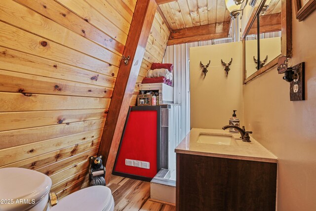 4872 N Trails End Dr, Pine, AZ 85544 - bathroom with toilet, wood walls, wood finished floors, and vanity