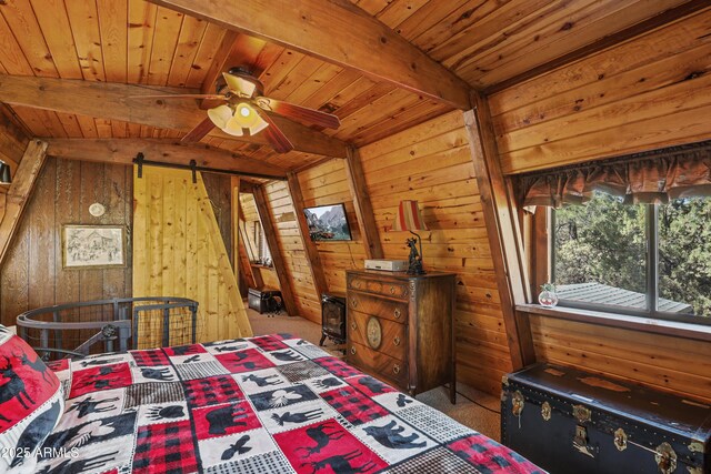 4872 N Trails End Dr, Pine, AZ 85544 - carpeted bedroom featuring wood walls, wood ceiling, and a barn door