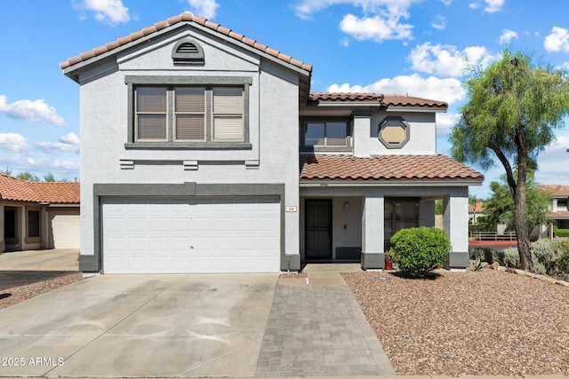 7500 E Deer Valley Rd Unit 54, Scottsdale, AZ 85255 - view of front of home with a tiled roof, stucco siding, an attached garage, and driveway