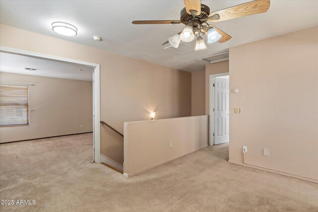7500 E Deer Valley Rd Unit 54, Scottsdale, AZ 85255 - carpeted empty room with baseboards, a smoke detector, ceiling fan, and attic access