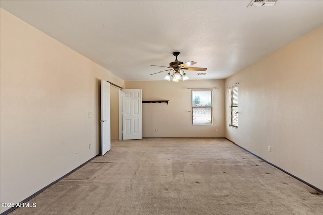 7500 E Deer Valley Rd Unit 54, Scottsdale, AZ 85255 - empty room with a ceiling fan, light carpet, and baseboards