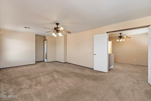 7500 E Deer Valley Rd Unit 54, Scottsdale, AZ 85255 - empty room featuring ceiling fan, light colored carpet, and baseboards