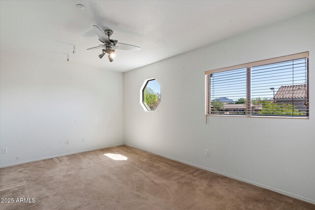 7500 E Deer Valley Rd Unit 54, Scottsdale, AZ 85255 - unfurnished room featuring carpet floors, a ceiling fan, and baseboards