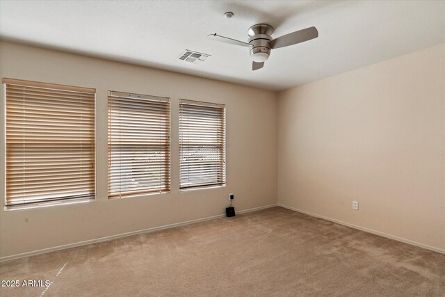 7500 E Deer Valley Rd Unit 54, Scottsdale, AZ 85255 - unfurnished room featuring ceiling fan, light carpet, and baseboards
