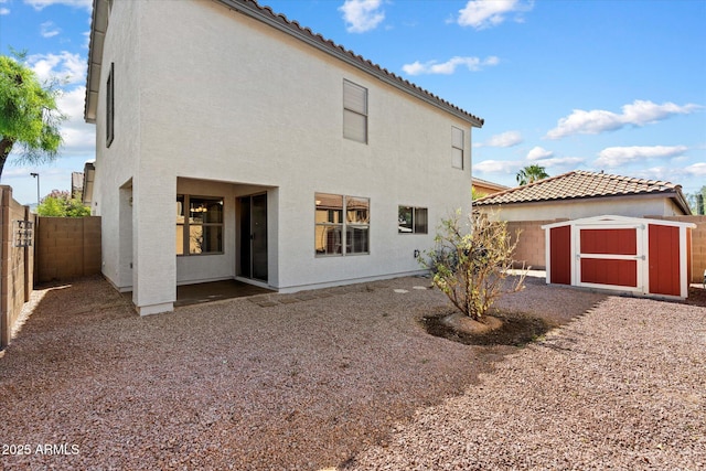 7500 E Deer Valley Rd Unit 54, Scottsdale, AZ 85255 - back of property with a fenced backyard, stucco siding, a tile roof, and a patio