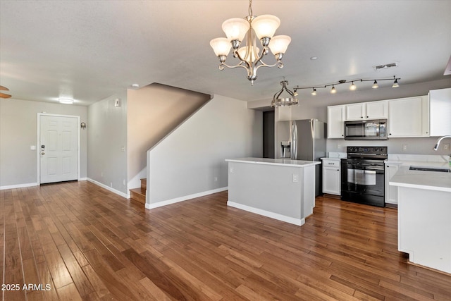 7500 E Deer Valley Rd Unit 54, Scottsdale, AZ 85255 - kitchen featuring stainless steel appliances, a sink, light countertops, a chandelier, and open floor plan