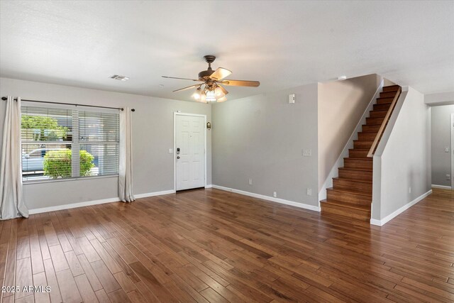 7500 E Deer Valley Rd Unit 54, Scottsdale, AZ 85255 - unfurnished living room with baseboards, stairs, ceiling fan, and wood finished floors