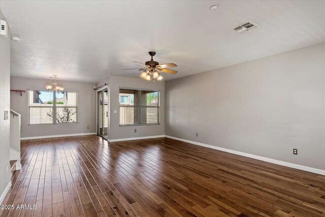7500 E Deer Valley Rd Unit 54, Scottsdale, AZ 85255 - unfurnished living room featuring a chandelier, ceiling fan, dark wood-style floors, and baseboards