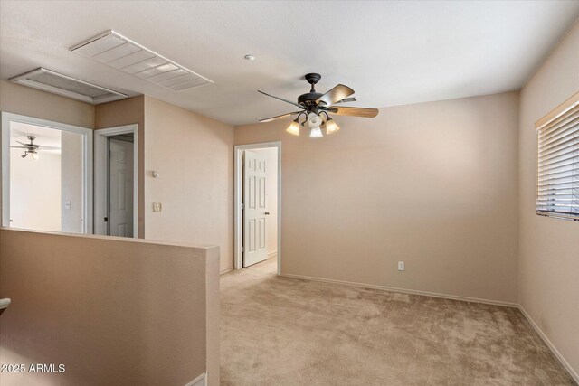 7500 E Deer Valley Rd Unit 54, Scottsdale, AZ 85255 - spare room featuring light colored carpet, a ceiling fan, and baseboards