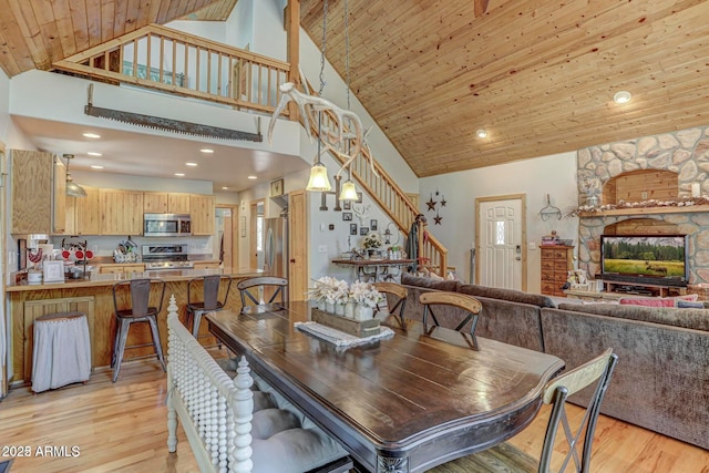 6124 W Hidden Pines Loop, Pine, AZ 85544 - dining room featuring high vaulted ceiling, stairway, light wood-style flooring, and recessed lighting