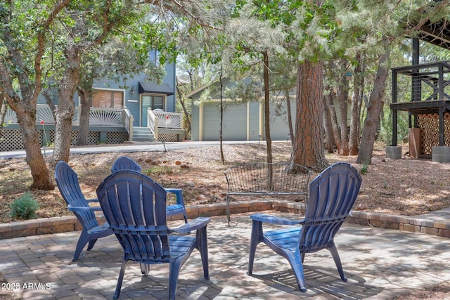 6124 W Hidden Pines Loop, Pine, AZ 85544 - view of patio / terrace featuring a garage