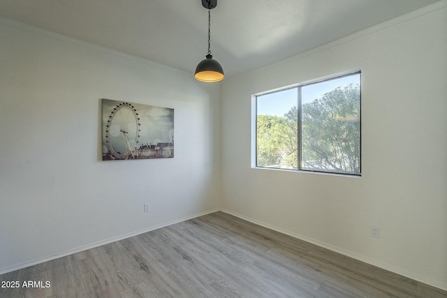 spare room featuring hardwood / wood-style floors