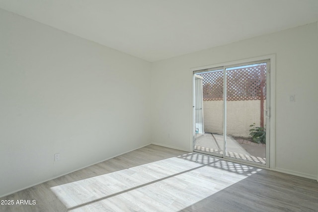 unfurnished room featuring light wood-type flooring