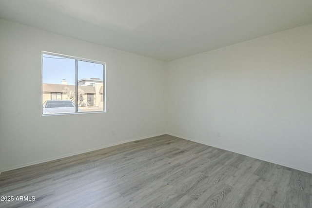 unfurnished room featuring light wood-type flooring