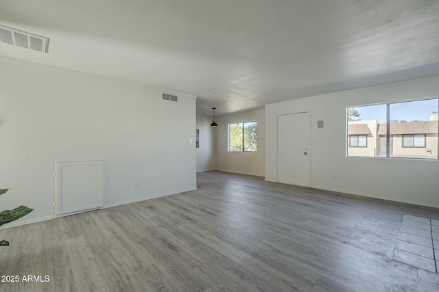 spare room with light hardwood / wood-style floors