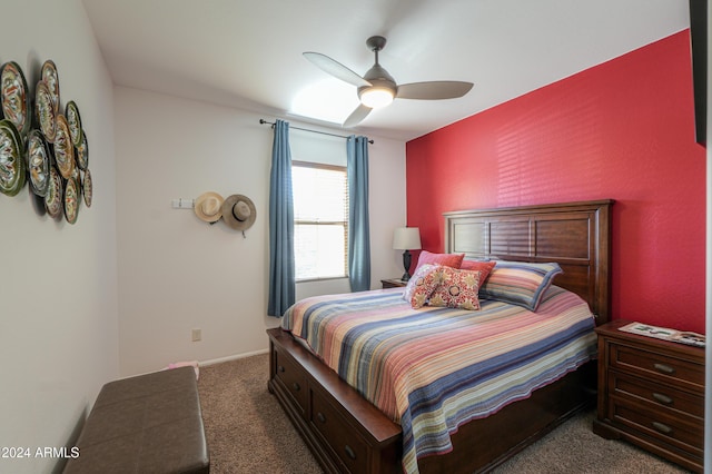 bedroom with ceiling fan and dark colored carpet